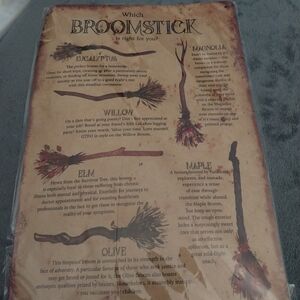 Metal broomstick sign